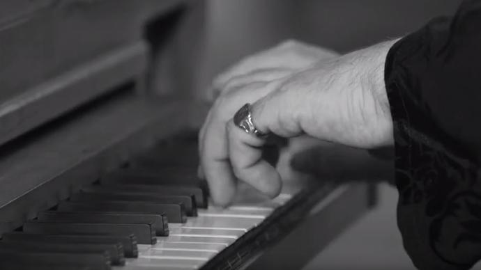 a photo of hands playing the piano