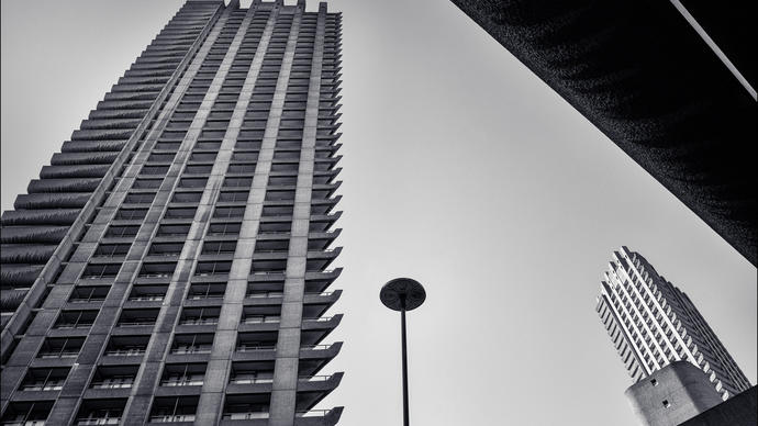 a black and white picture of the barbican towers in central london