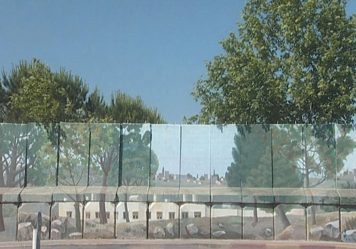 an image of a glass wall with blue sky and trees behind it