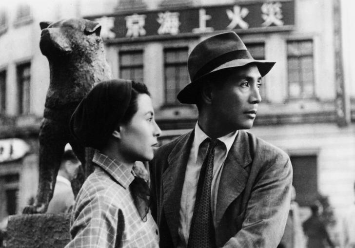 A black and white image of a man and a woman in Japan in the 1940s