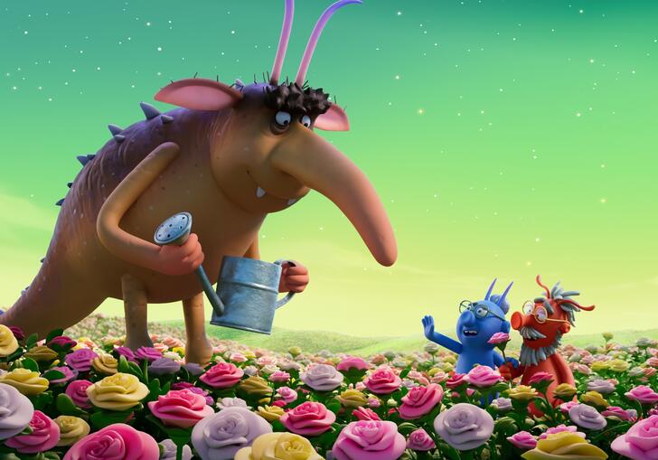 An anteater-type anumal talks to smaller animals in a flower-filled landscape.