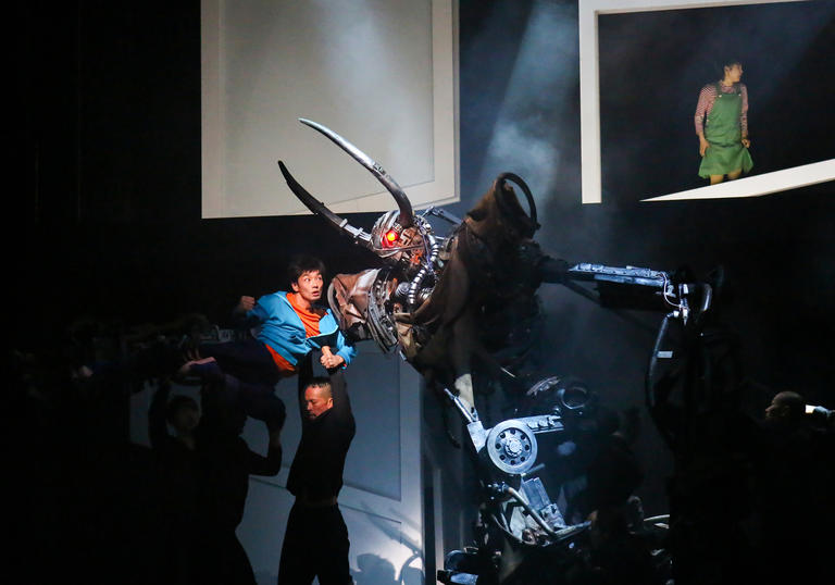 Image of robot and boy fighting