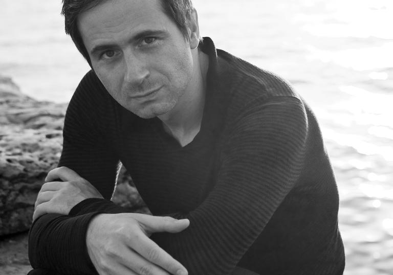 A black & white photograph of Piotr Andrejewski