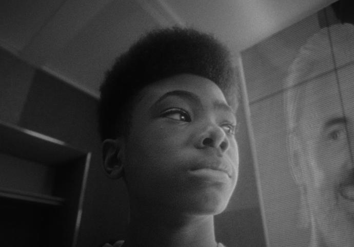 black and white image of a young black boy