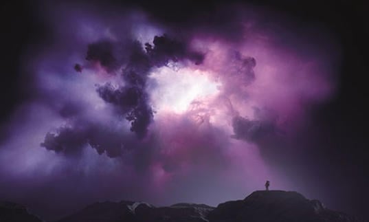 Photo of purple space landscape with a human figure in the distance