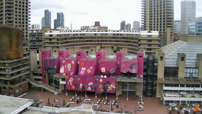 wide angle photograph of the lakeside terrace facade - being wrapped in fabric for ibrahim mahama's purple hibiscus