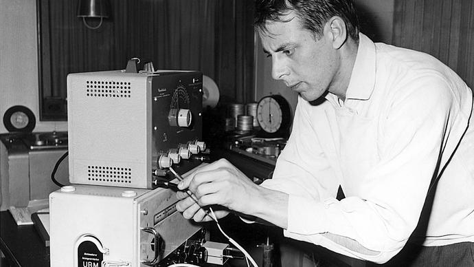 Photo of composer Stockhausen working in the studio