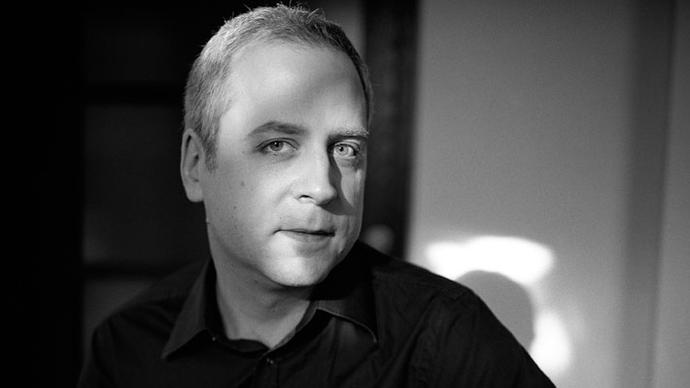 a black and white photo of pianist jeremy denk