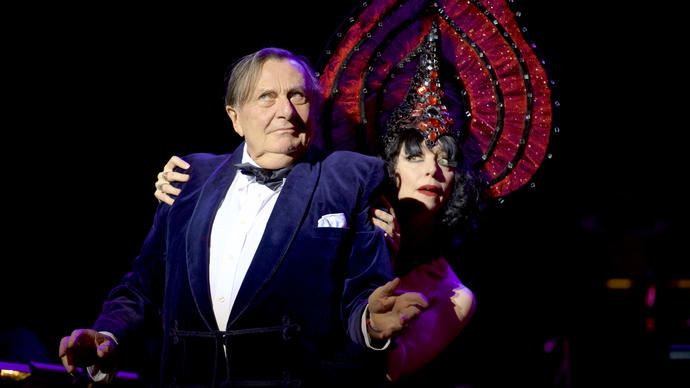 photo of barry humphries on stage with a female dancer