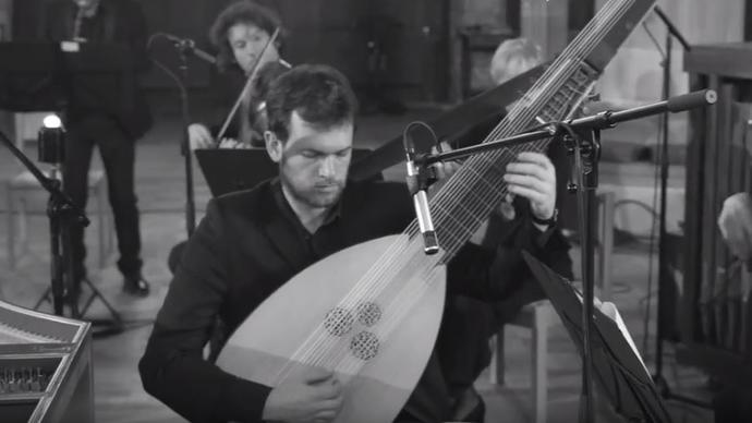 photo of a man palying an instrument