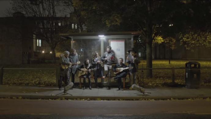 a photo of the mexrrissey band playing at night 