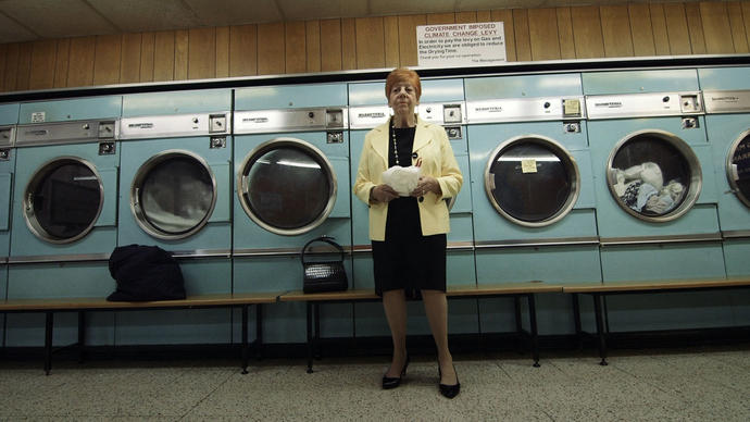 Woman standing in front of washing machines