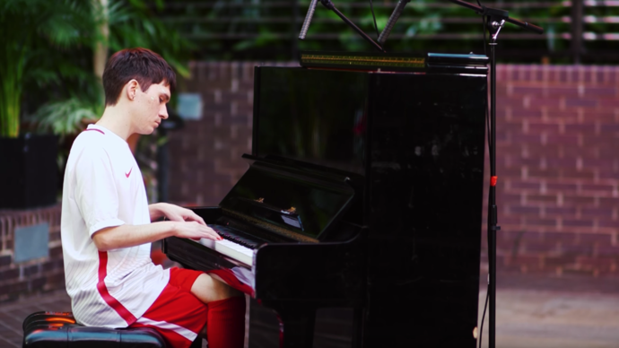 Photo of man playing piano