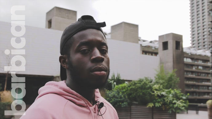 Photo of young man in pink hoodie