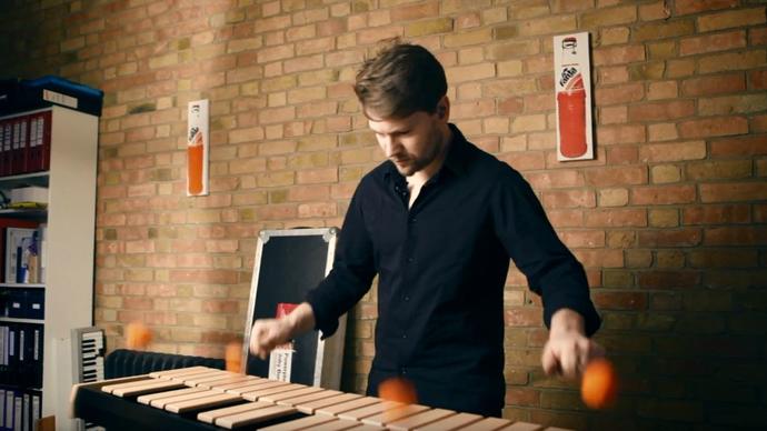 photo of man playing instrument