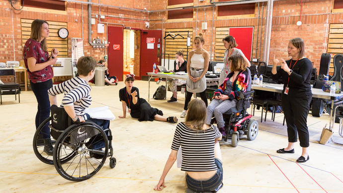 A group of people sat in a circle