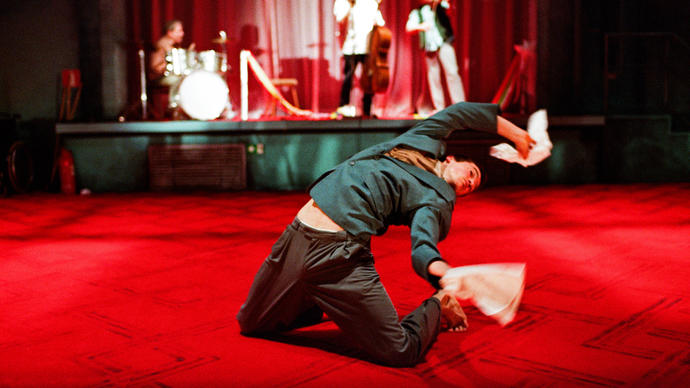 One dancer in front of a stage