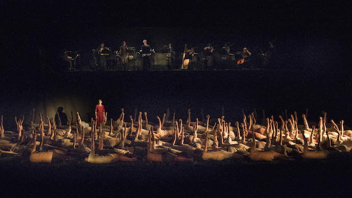 a hundred people on the floor in a theatre