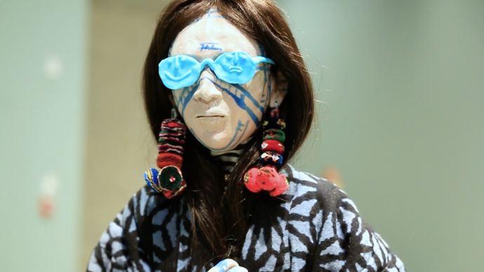 photo of sculpture of woman with blue sunglasses
