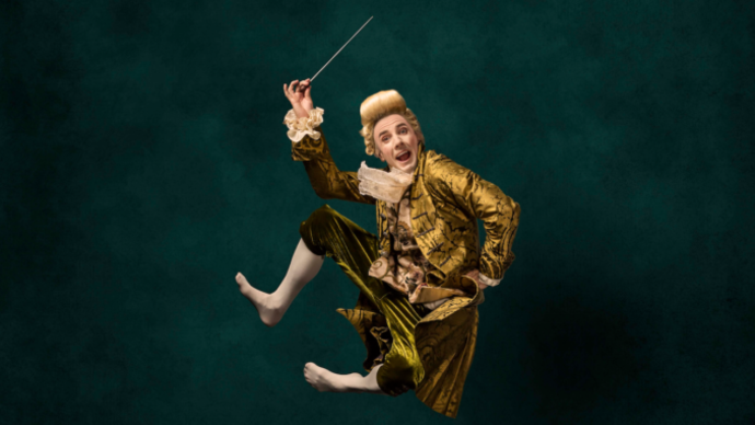 man dressed as mozart jumping
