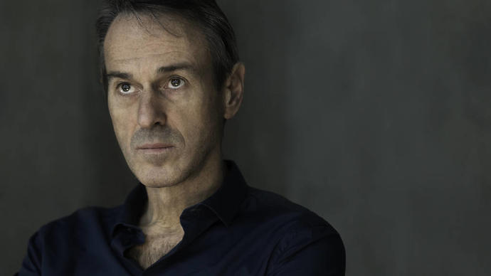 ivo van hove looking broodily into the distance