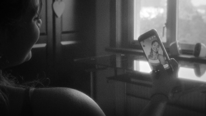 black and white photo of girl taking a selfie