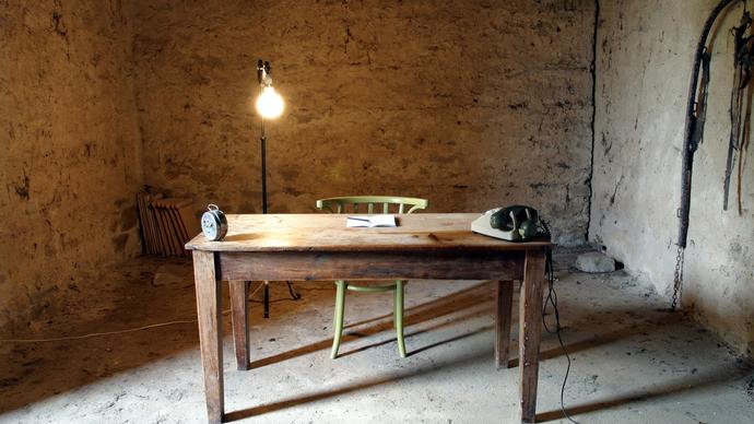 photo of a desk in the middle of a room