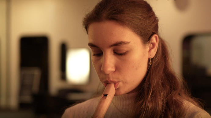 a women with a recorder