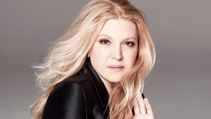 Eliane Elias facing the camera with her hand in her hair