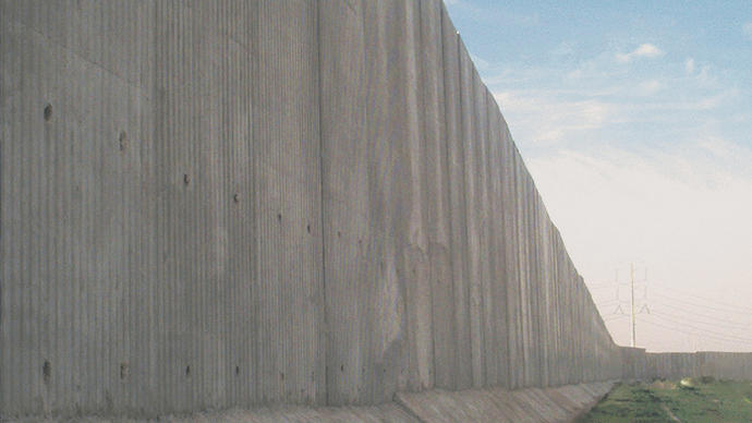 The berlin wall against a blue sky