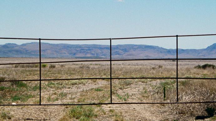 photo of some gate in the desert