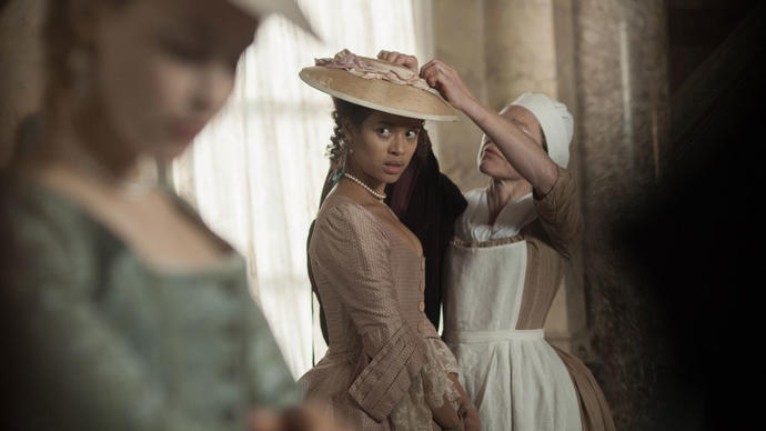 two women in period costumes