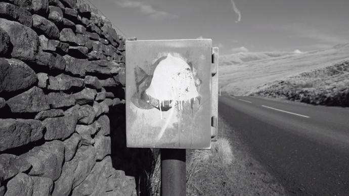 black and white photo of a mailbox