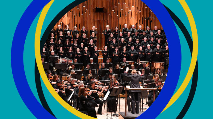 BBC Symphony Chorus on the Barbican stage, with BBC SO branding around the edges