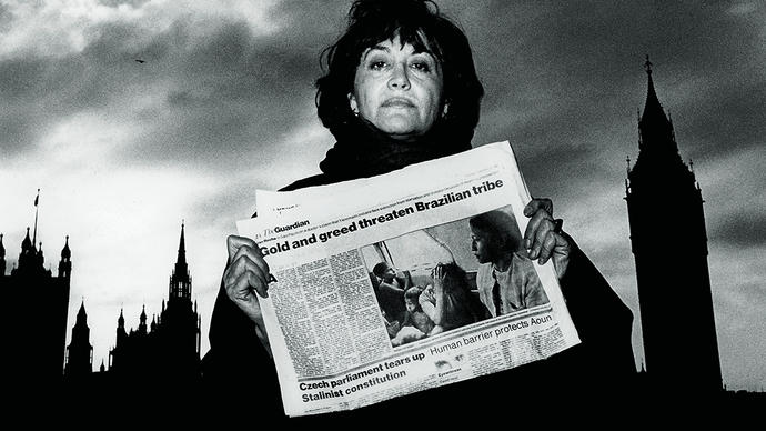 A woman holding a newspaper