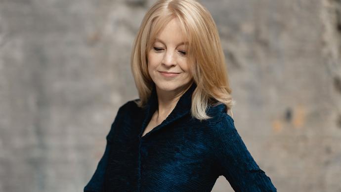 colour photo of Maria Schneider wearing a black jacket