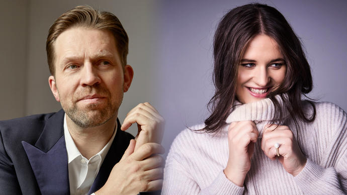 In the left of the image Leif Ove Andsnes is looking to his right slighty, holding his left hand with his right. In the right of the image Lise Davidsen is smiling and looking to her left, holding the neckline of her jumper.