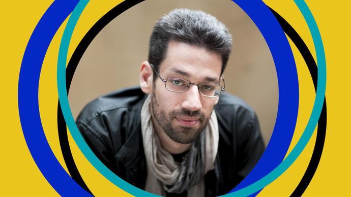 Pianist Jonathan Biss is in the centre of the frame, with BBC Symphony Orchestra branding around the edge of the image