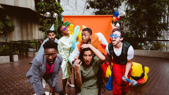 The PappyShow ensemble having a party in the Barbican conservatory. 