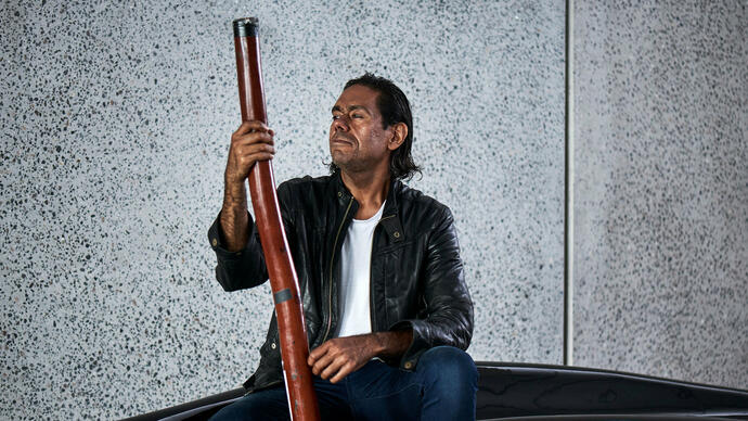 William Barton holding a didgeridoo