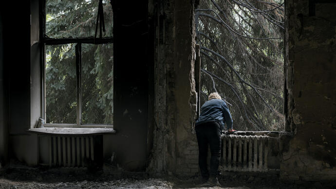 Man stands at a window