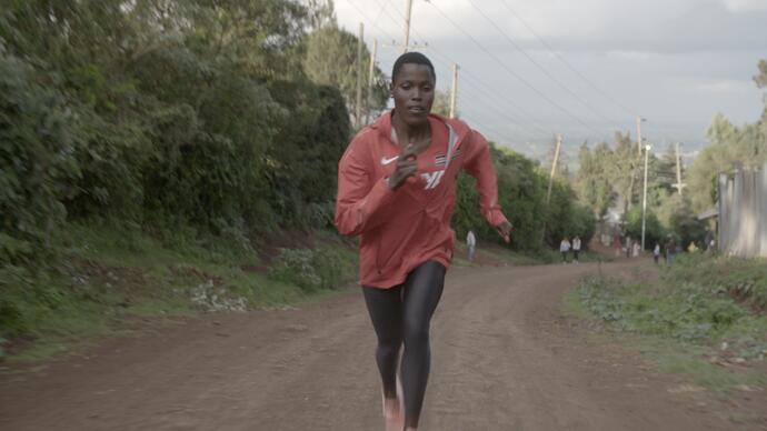 An athlete trains on a road 