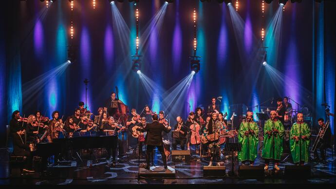 Jerusalem Orchestra East West performing on stage smiling