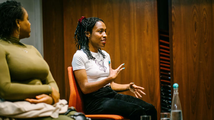 Two panellist sitting and facing the audience