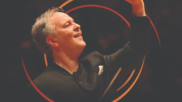 Sakari Oramo conducting, with circular orange swirls around him