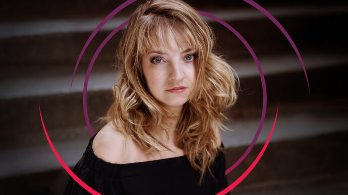 Lise de la Salle looking at the camera, with purple and pink circular lines framing her face