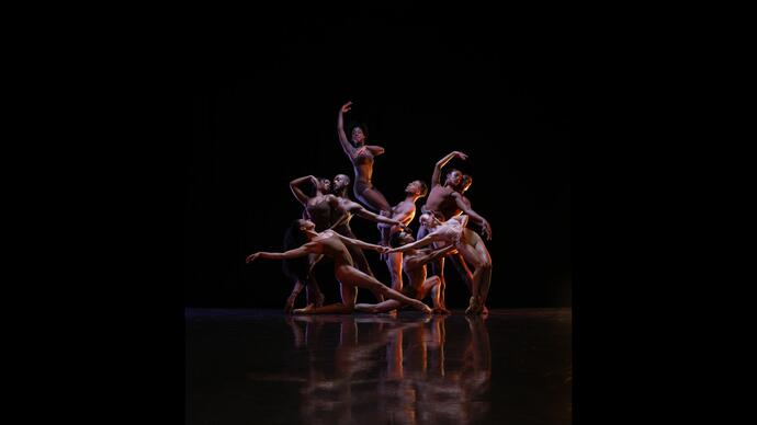 Members of the Ballet Black company pose against a black background.