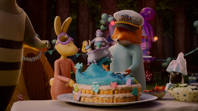 A group of animals stand in a house around a birthday cake.