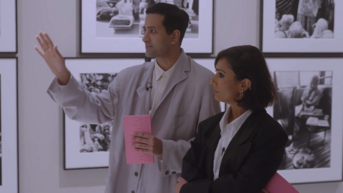Shanay Jhaveri and Anita Rani looking at black and white photographs on the walls of the gallery