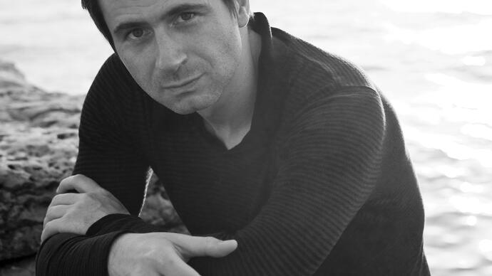 A black & white photograph of Piotr Andrejewski